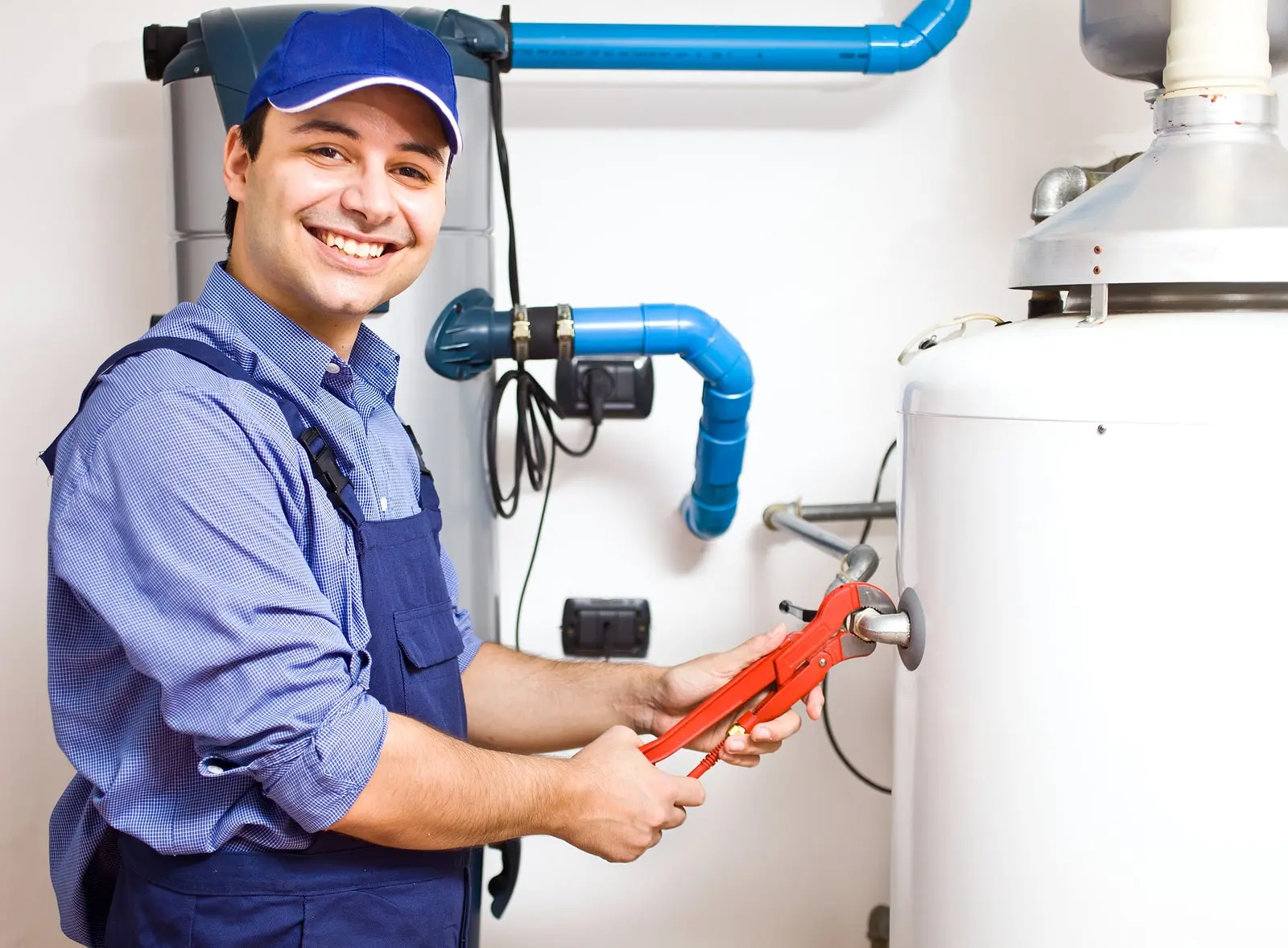 plumber working on water tank